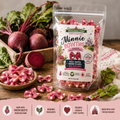 Packaged dog treats labeled 'Minnie BOWTIES' with beetroot and packaging on a wooden surface.
